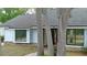 Charming home featuring light blue siding, black window trim and a brick-lined entrance at 1845 Spruce Creek Blvd, Port Orange, FL 32128