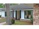 Charming home featuring light blue siding, black window trim and a brick-lined entrance at 1845 Spruce Creek Blvd, Port Orange, FL 32128