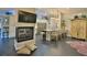 Kitchen flows into a living space, featuring a fireplace and island seating, ideal for gatherings at 1845 Spruce Creek Blvd, Port Orange, FL 32128