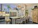 Open kitchen featuring a marble-top island with seating and stainless steel appliances at 1845 Spruce Creek Blvd, Port Orange, FL 32128