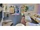 Spacious living room with tile flooring, plush seating, and views to the kitchen at 1845 Spruce Creek Blvd, Port Orange, FL 32128