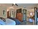 Cozy bedroom with modern furniture and an open view to the living area at 1845 Spruce Creek Blvd, Port Orange, FL 32128