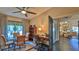 Office area featuring a glass table and desk that connects to the main bedroom at 1845 Spruce Creek Blvd, Port Orange, FL 32128