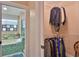 View into closet showing clothing racks, shelving, and doorway to an en suite at 1845 Spruce Creek Blvd, Port Orange, FL 32128