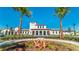 Beautiful clubhouse exterior with manicured landscaping and elegant architectural details and design at 1876 Nice Ct, Kissimmee, FL 34747