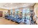 Community gym with treadmills and stationary bikes overlooking the pool at 1876 Nice Ct, Kissimmee, FL 34747
