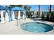 Relaxing hot tub with accessibility rails and a private cabana; the perfect place to unwind at 1876 Nice Ct, Kissimmee, FL 34747