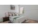 Serene bedroom with a comfortable bed, marble nightstands, and plenty of natural light at 2218 Ridgewind Way, Windermere, FL 34786