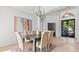 Elegant dining room with a decorative painting and comfortable seating for six at 2218 Ridgewind Way, Windermere, FL 34786