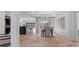 Open dining room with stylish light fixture and access to outdoor living space at 2218 Ridgewind Way, Windermere, FL 34786