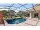 Beautiful screened-in pool with a tranquil backyard view and a spacious patio area for relaxation at 2218 Ridgewind Way, Windermere, FL 34786