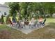 Inviting backyard fire pit area with colorful chairs, perfect for entertaining guests at 30413 Plymouth Creek Cir, Sorrento, FL 32776