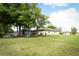 Large backyard with ample space, fire pit, and pool enclosure, perfect for outdoor activities at 30413 Plymouth Creek Cir, Sorrento, FL 32776
