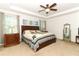 Serene main bedroom with a tray ceiling and a comfortable bed at 30413 Plymouth Creek Cir, Sorrento, FL 32776
