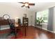A well-appointed office with a large window, a desk, and ample storage, perfect for working from home at 30413 Plymouth Creek Cir, Sorrento, FL 32776