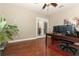 Bright office with wood floors, double doors and a spacious work area at 30413 Plymouth Creek Cir, Sorrento, FL 32776