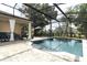 Lovely backyard pool area with a covered patio, lounge chairs, and access to the pool at 30413 Plymouth Creek Cir, Sorrento, FL 32776