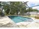 Enjoy a refreshing swim in this private screened-in pool, surrounded by a brick patio and lush landscaping at 30413 Plymouth Creek Cir, Sorrento, FL 32776