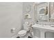 Elegant powder room featuring a pedestal sink and decorative accents at 3144 Players View Cir, Longwood, FL 32779