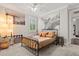 Bedroom featuring carpeted floors, comfortable bed, stylish decor, and artwork at 3144 Players View Cir, Longwood, FL 32779