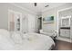 Inviting bedroom featuring a sunny window, a vanity, and ensuite access at 3144 Players View Cir, Longwood, FL 32779