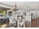 Contemporary dining area blending with the open kitchen and views to the outdoor patio at 3144 Players View Cir, Longwood, FL 32779