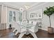 Spacious dining room with modern lighting fixture and bright windows at 3144 Players View Cir, Longwood, FL 32779