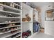 Spacious walk-in closet with custom shelving and storage solutions for shoes, clothes and accessories at 3144 Players View Cir, Longwood, FL 32779