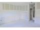 Unfinished bedroom with neutral color scheme and large window allowing natural light at 315 E Magnolia St, Davenport, FL 33837