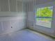 Unfinished bedroom with a large window that offers natural light at 315 E Magnolia St, Davenport, FL 33837