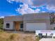 Contemporary home with clean lines, neutral color palette, two-car garage, and modern design at 315 E Magnolia St, Davenport, FL 33837