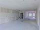 Unfinished living room showcasing an open layout, recessed lighting and natural light at 315 E Magnolia St, Davenport, FL 33837