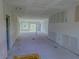 Spacious unfinished living room featuring an open floor plan and natural light at 315 E Magnolia St, Davenport, FL 33837