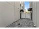 Cozy backyard featuring stone pavers, a drain, privacy walls, and exterior lighting at 336 Center Lake Ln # A-2, Oviedo, FL 32765