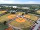 Aerial view of multiple baseball fields surrounded by lush greenery and a scenic lake at 336 Center Lake Ln # A-2, Oviedo, FL 32765