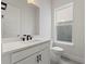 Bathroom featuring a single sink, a window, tiled floors, and modern hardware at 336 Center Lake Ln # A-2, Oviedo, FL 32765