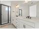 Modern bathroom featuring double sinks, white cabinetry, quartz countertop, and black hardware at 336 Center Lake Ln # A-2, Oviedo, FL 32765