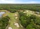 Scenic aerial view of a lush golf course with sand traps and winding fairways at 336 Center Lake Ln # A-2, Oviedo, FL 32765