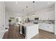 Bright and airy kitchen featuring white cabinets, a center island, and stainless steel appliances is perfect for cooking at 336 Center Lake Ln # A-2, Oviedo, FL 32765