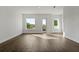 Bright living room with wood floors, neutral walls, and ample natural light from a balcony access at 336 Center Lake Ln # A-2, Oviedo, FL 32765