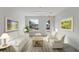 A comfortable lounge area with matching white furniture and bright light at 336 Center Lake Ln # A-2, Oviedo, FL 32765