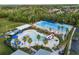 Expansive community pool area with multiple pools, a water slide, and plenty of lounging space at 336 Center Lake Ln # A-2, Oviedo, FL 32765
