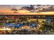 Vibrant shopping center at dusk, featuring a variety of shops, restaurants, and ample parking at 336 Center Lake Ln # A-2, Oviedo, FL 32765