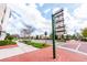 Landscaped street view with retail and restaurant signs in 'Oviedo on the Park' at 336 Center Lake Ln # A-2, Oviedo, FL 32765