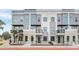 Modern townhome exteriors featuring stone accents, balconies, and well-maintained landscaping create inviting curb appeal at 336 Center Lake Ln # A-2, Oviedo, FL 32765