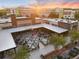 Aerial shot of bustling outdoor food hall with sunset, tables and buildings at 336 Center Lake Ln # A-2, Oviedo, FL 32765