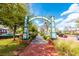 Paved walking path beneath the archways near retail buildings in 'Oviedo on the Park' at 336 Center Lake Ln # A-2, Oviedo, FL 32765