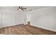 Bedroom features wood-look floors and a closet with bi-fold doors at 33830 S Haines Creek Rd, Leesburg, FL 34788