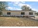 Charming single-story home with nicely landscaped front yard and white exterior paint at 33830 S Haines Creek Rd, Leesburg, FL 34788