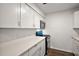 Kitchen with quartz countertops, white cabinetry, and modern appliances at 33830 S Haines Creek Rd, Leesburg, FL 34788